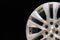 New powerful silver aluminum rim wheel for suv cars original on black background . beautiful concept, close-up. shot in