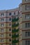 New or recently completed multi-storey residential building with windows and balconies. Russian type of house buildin