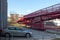 New red bridge over railway and block of flats