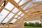 New residential construction home framing against a blue sky. Roofing construction. Wooden construction.