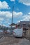 New Residential  Homes Under Construction on Scottish Building Site in Winter with a Preconstructed Roof being lifted with a Crane