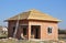 New Roof Membrane Coverings Wooden Construction Home Framing with Roof Rafters and Metal Ladder Outdoor against a Blue Sky.