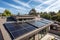 new roof with solar panels and skylights, showcasing the future of energy-efficient homes