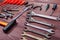 New and rusty of repairman tools for repair work on wooden background