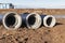 New sewer reinforced concrete pipes lie on the construction site. Reconstruction of the sewerage and water disposal system. The