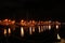 New ships arriving at the shore at night with soft light vials reflected in the water Port Louis Mauritius caudan