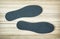 New shoe insoles on the wooden background
