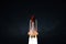 New space shuttle rocket with blast successfully takes off into the night starry sky. Spaceship launched into outer deep space