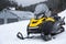 New stylish snowmobile parked outdoors. Winter