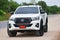 New Toyota Hilux Revo Rocco white Pickup Truck Offroad Car double cab 4x4 On a dirt road