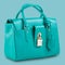 New turquoise women bag on a blue pastel background