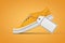 New Unbranded Orange Denim Sneakers with White Blank Mockup Price Tag. 3d Rendering