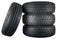 New and unused car tires against isolated background