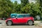 New used red Mini Cooper hatchback small compact car parked on the street in the city