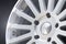 New vehicle rims made from aluminum alloy, multi-spoke silver wheel, close-up on a black background