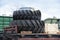 New wheel tyres for farm tractors and agriculture machinery being shipped on rails on freight train.