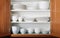 New White Dishes and Bowls in Kitchen Cabinet