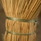 A new wicker broom handle closeup with green ropes