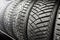 New winter studded tires in store. sale of winter wheels. ice, seasonal change of tires.