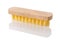 New wooden cleaning brush with yellow coarse stiff bristles isolated on white background. Simple tool for housework close-up. Ð¡