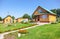 New wooden country house with outbuildings