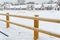 New wooden fence corral for outdoor horses. Empty Horse paddock covered with snow