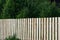 New wooden fence, high wooden fence of new boards