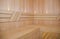 New wooden traditional Finland-style sauna made from pine wood.Classic sauna interior,clean, dry benches. Modern