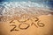 New Year 2016 is coming concept - inscription 2015 and 2016 on a beach sand