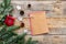 New year 2018 greeting with pine cones, notebook and decorations on wooden background top veiw space for text