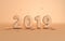 New year 2019 celebration background. Matt plastic beige numeral