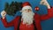New year 2019, man like a Santa with Christmas tree and red ball bauble toy, on blue background
