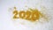 New Year 2020 is coming concept, The wind blew yellow glittery glitter show 2020 isolated on white background.