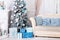 New Year 2020. Merry Christmas, happy holidays. Classic christmas interior with decorated christmas tree. Living room decor with C