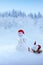 New year 2023 background with Christmas snowman and red hat .