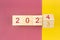 New year 2023 change to 2024. Flip over wooden cube block