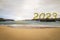 New year 2023 dawning on a quiet beach