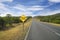 New year ahead sign post with blue sky and road