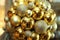 New Year background. New Year`s round golden balls. Christmas balls close up picture. Three golden christmas sparkling