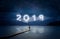 New year background, young man standing on a jetty in a lake and looking to the mountains under the dark sky with cloudy text 2019