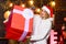 New year. Really big. Giant surprise. She deserves all best. Girl santa hat hold enormous gift box. If you have lot of