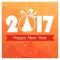 New Year card with orange polygonal background and Christmas ball with tree