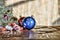 A New Year, Christmas. Christmas decorations, multi-colored balls and gifts with a Christmas tree on a wooden background with a co