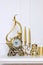 New Year and Christmas composition. Decorative golden clock, thick candles and candlestick