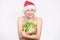 New year and christmas concept. Exotic christmas holidays. Girl attractive naked wear santa hat hug watermelon