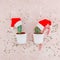 New Year or Christmas creative composition flat lay top view Xmas holiday celebration handmade santa cactuses pink golden stars