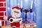 New Year and Christmas decor. Plush Santa, candlestick with two candles