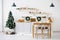 New year and Christmas. Festive Scandinavian cuisine in Christmas decorations. Candles, fir branches, wooden stands, table