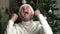 New Year or Christmas, portrait of a young cheerful happy man. Emotional man dancing in a Santa hat