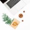 New year composition. Laptop with Christmas gift box and pine cone on white background. Top view. Flat lay